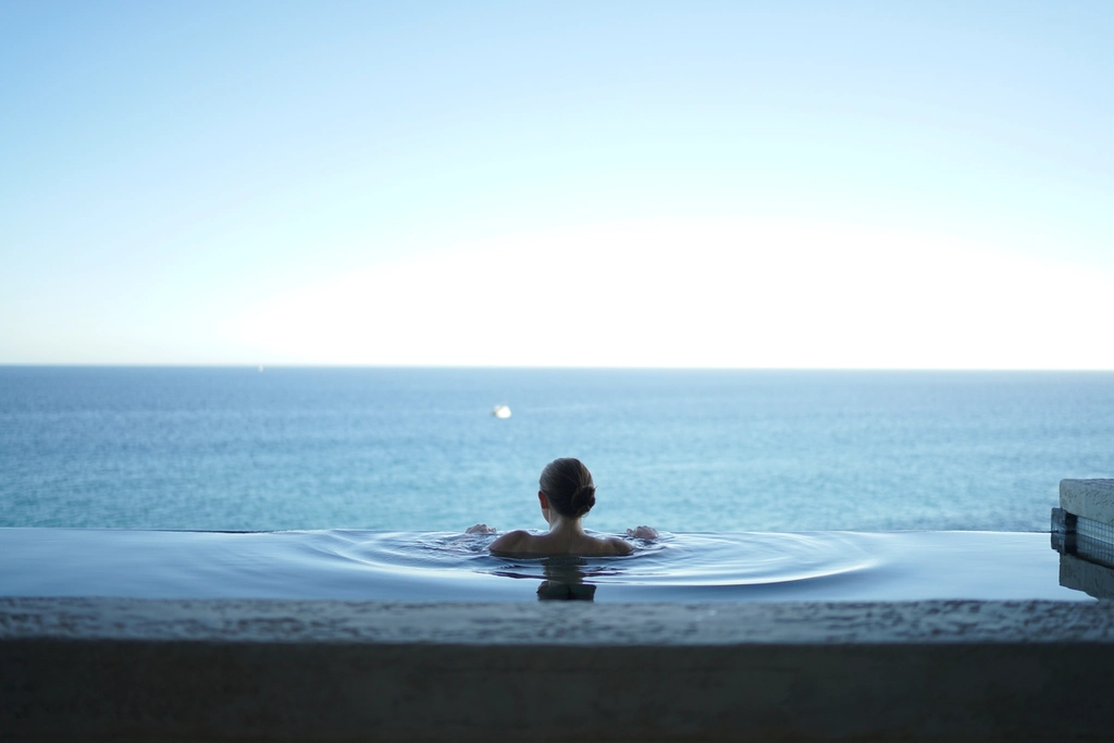 woman bathing pool overlooking vast